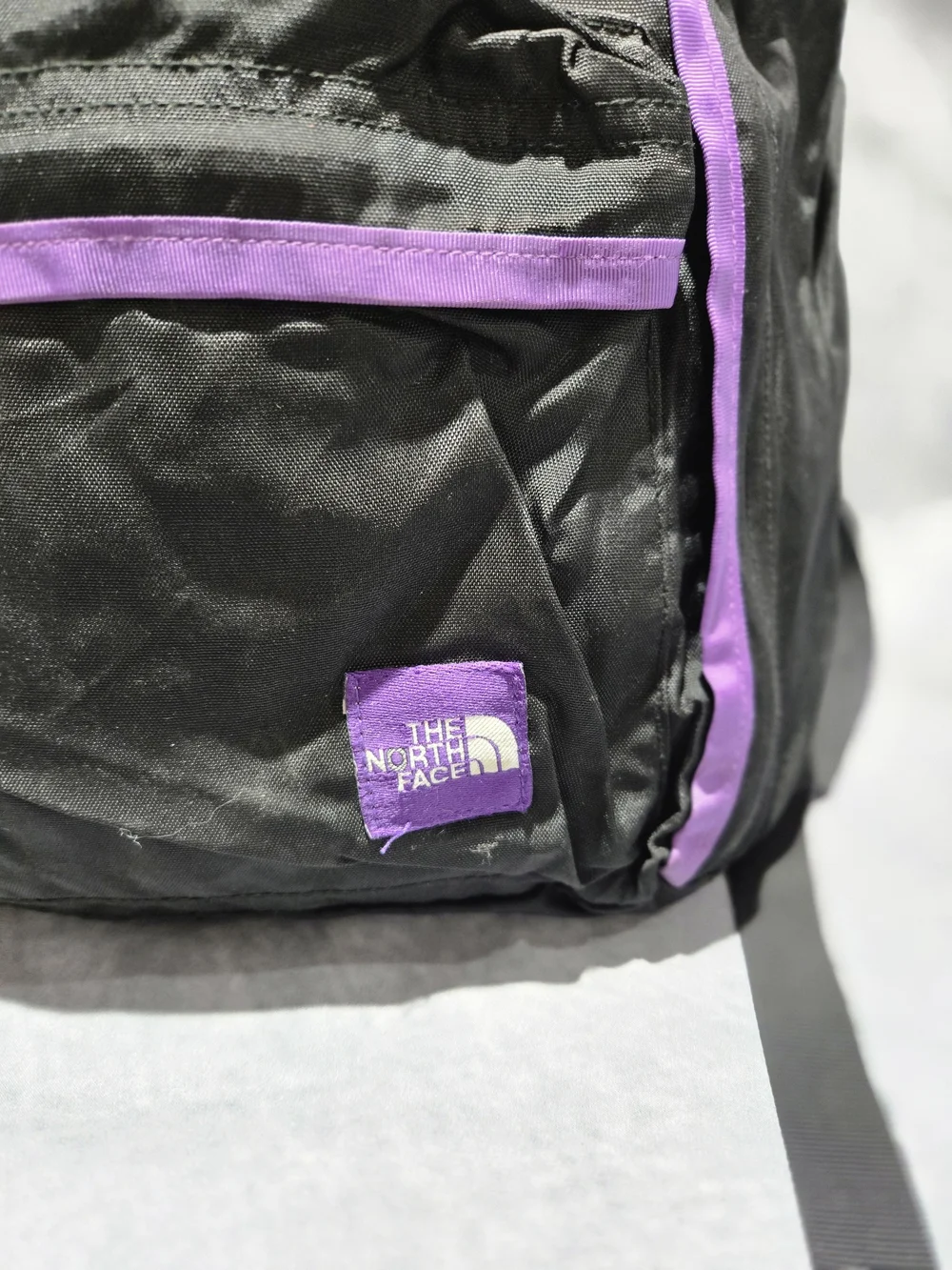 The North Face Black Backpack with Purple Accents